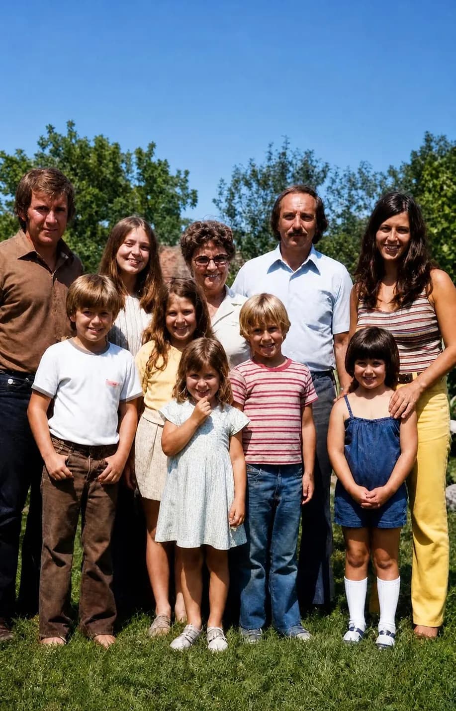 Restored family photograph: three generations gathered on the lawn on a bright summer day
